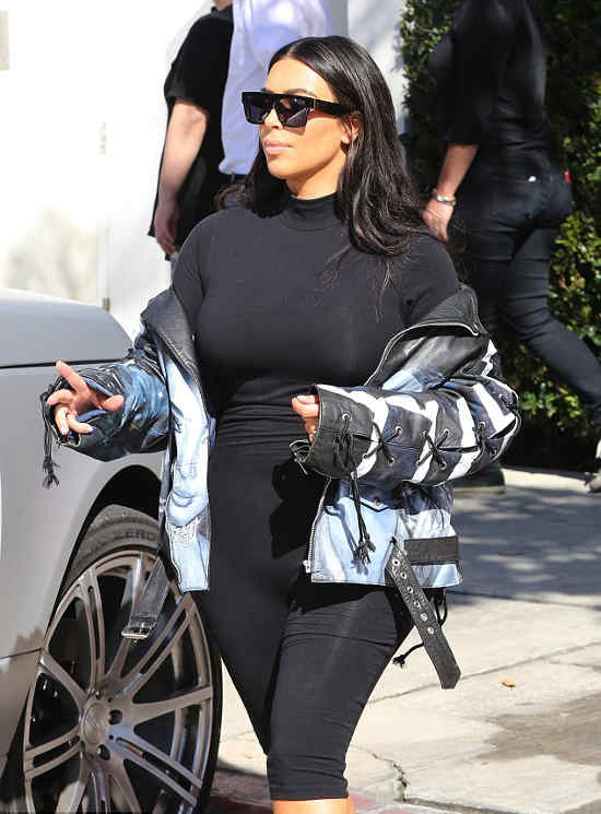 Kim Kardashian rocked a low-key look with her make-up and brandished - AngryGIF